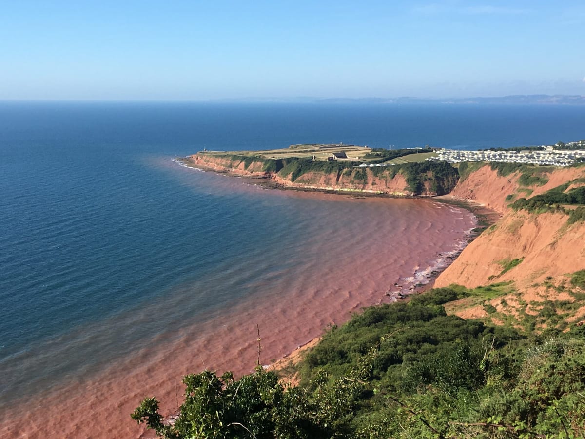 Along Red Cliffs Bitten Away By Landfalls