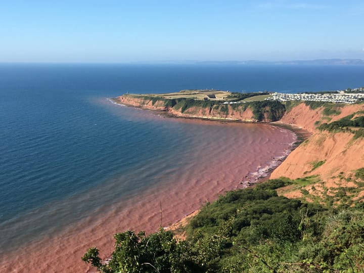 Along Red Cliffs Bitten Away By Landfalls