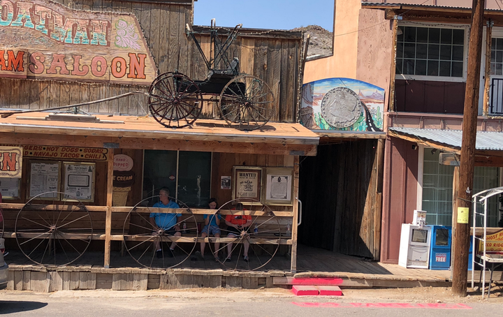 On Route 66, A Cowboy Rides Into A Dusty Town